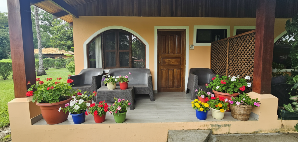 Front porch seating area at Villagio 1 Unit 25, a walk to beach condo Playa Potrero with outdoor living space