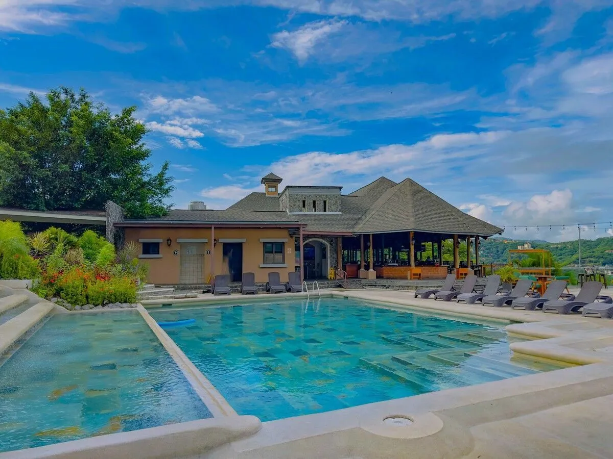 Villas Sol 57-1 pool area in Playa Hermosa showcasing resort-style living Guanacaste with tropical terrace and lounge chairs