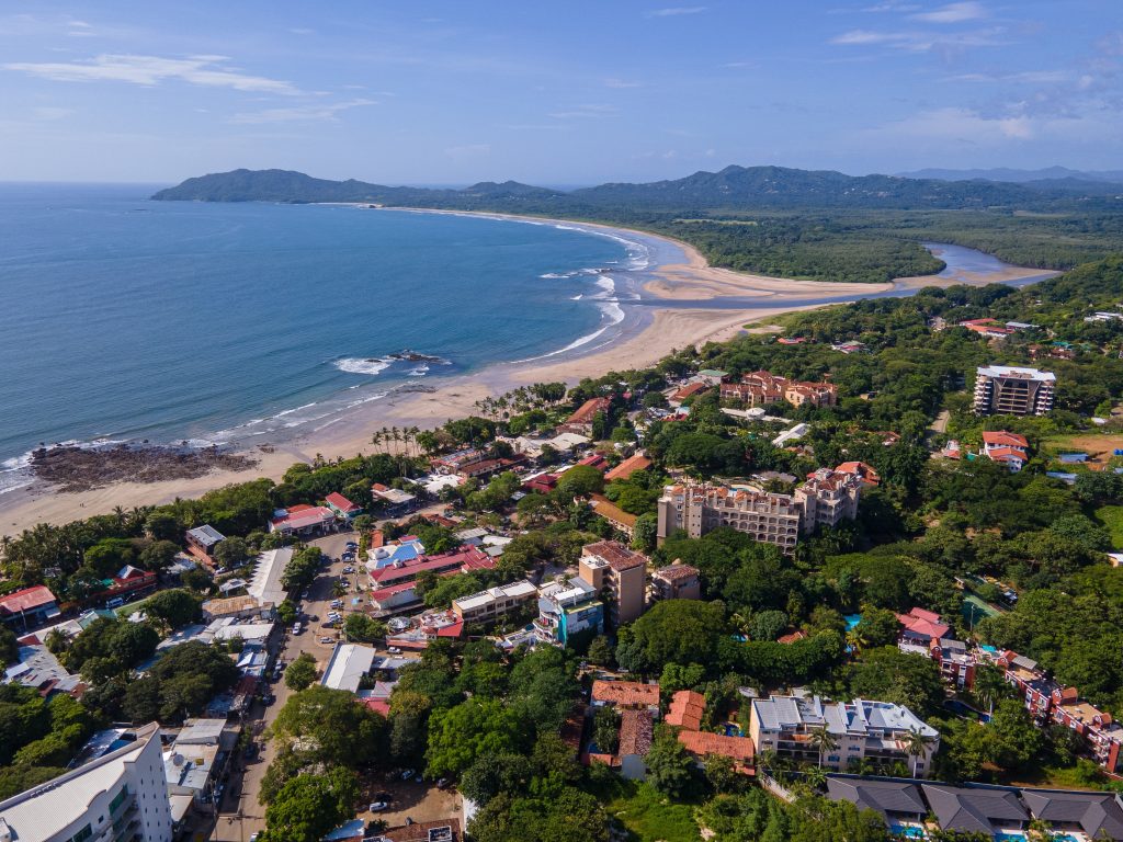 Aerial view of Tamarindo town and coastline in Guanacaste Costa Rica, illustrating real estate in Tamarindo Costa Rica