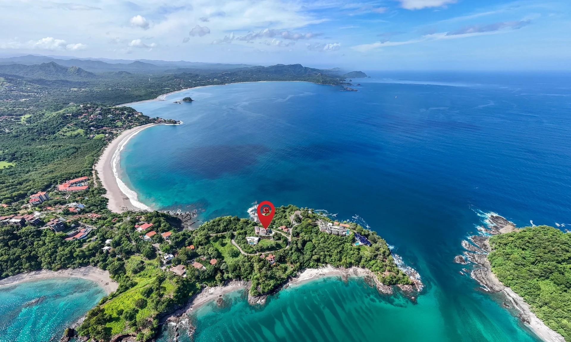 Casa Linda Vista aerial view above Playa Flamingo Costa Rica coastline showing peninsula setting and surrounding ocean
