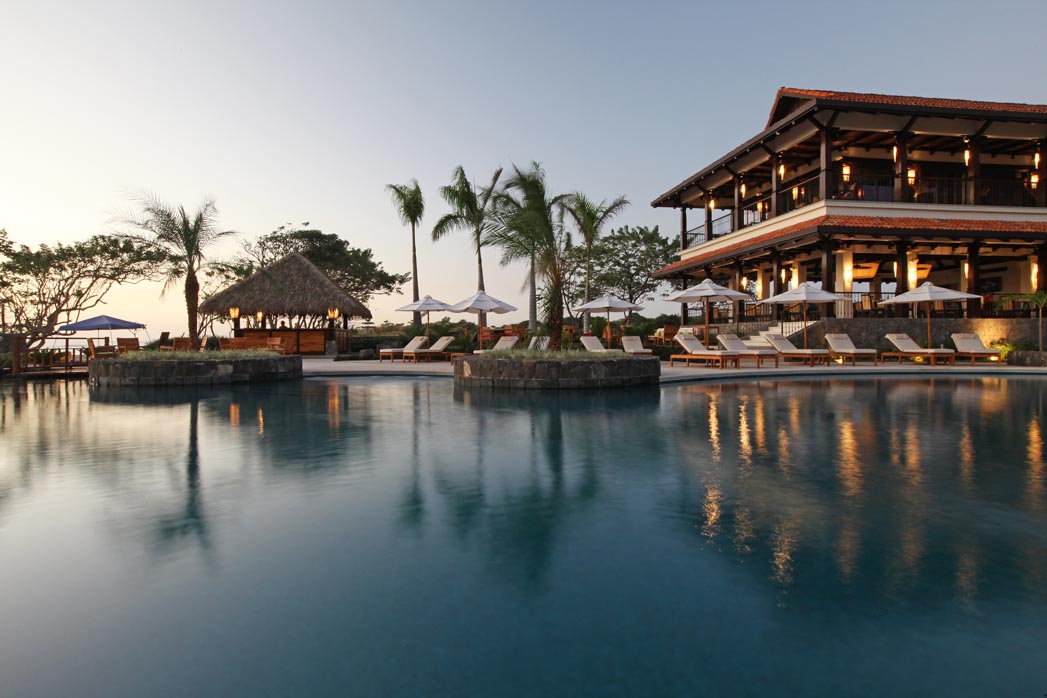 Hacienda Pinilla Beach Club pool and resort amenities for real estate investment buyers