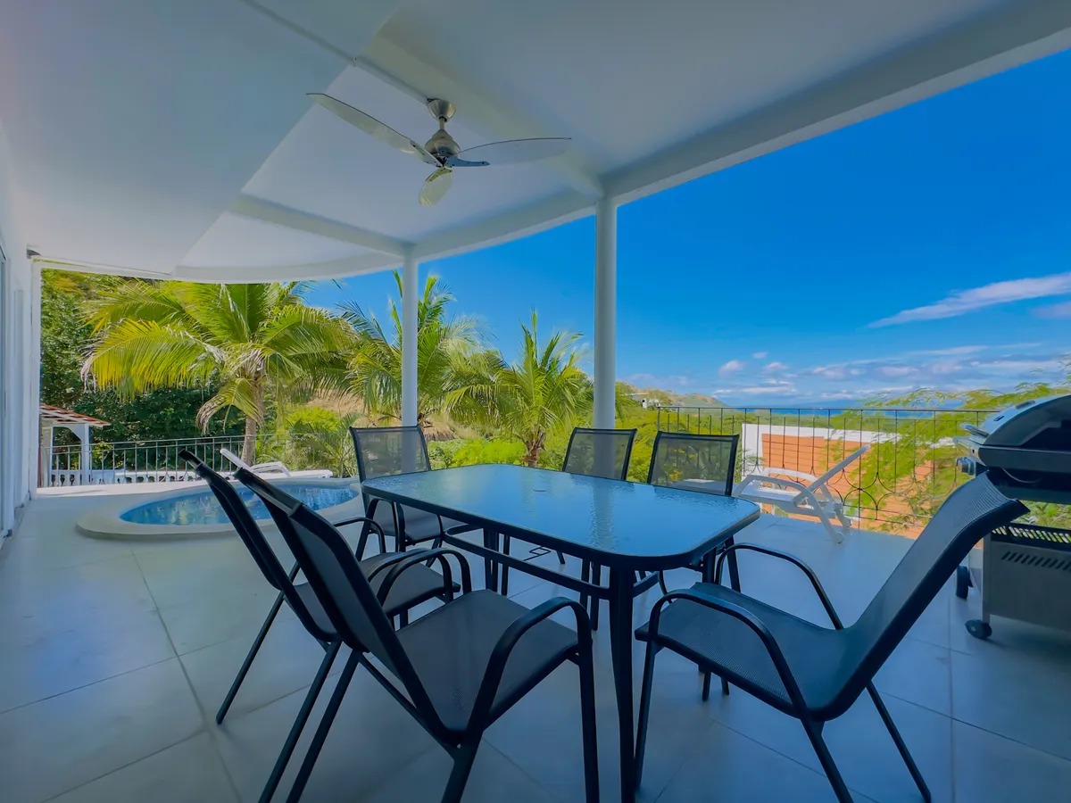 Ocean view terrace with outdoor dining and private plunge pool at Casa Bella Luna