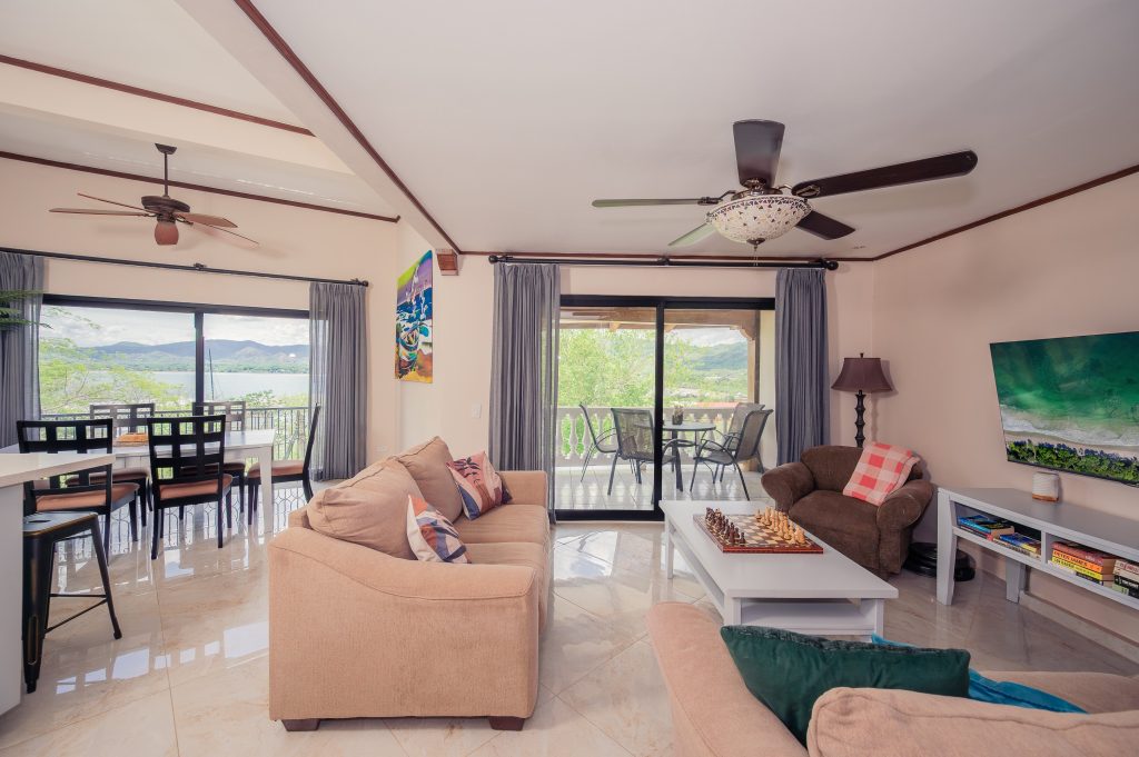 Spacious living area with balcony access at Flamingo Marina Real Penthouse 133