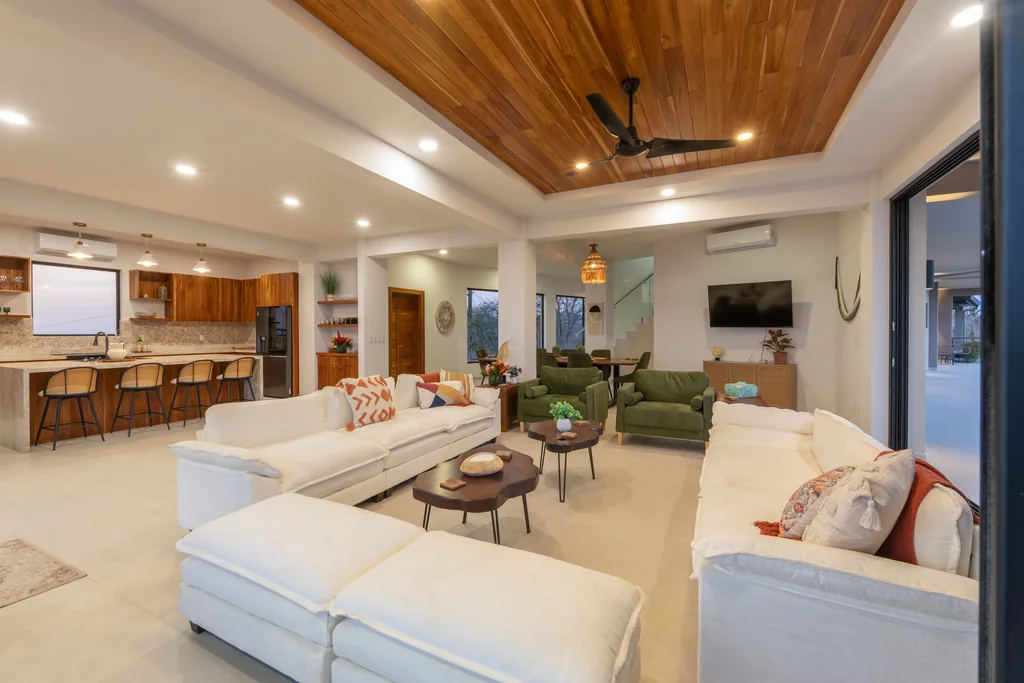 Casa Vista Escondida interior — open-plan living and kitchen with wood ceiling and indoor-outdoor living in Guanacaste, Costa Rica