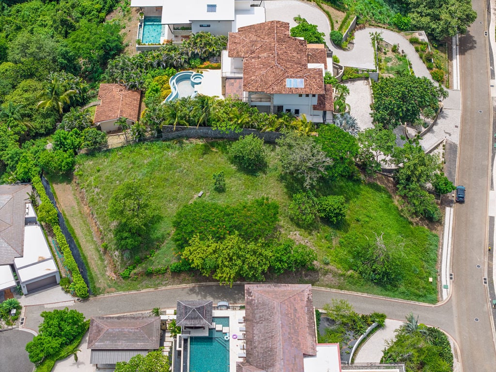 Lot 6A estate lot surrounded by luxury homes in Senderos Tamarindo