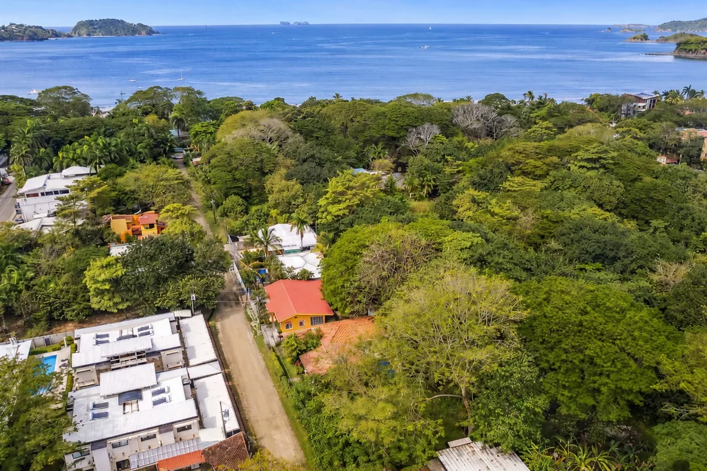 Aerial view of building lots and homes near the beach in Playa Potrero, Guanacaste, Costa Rica