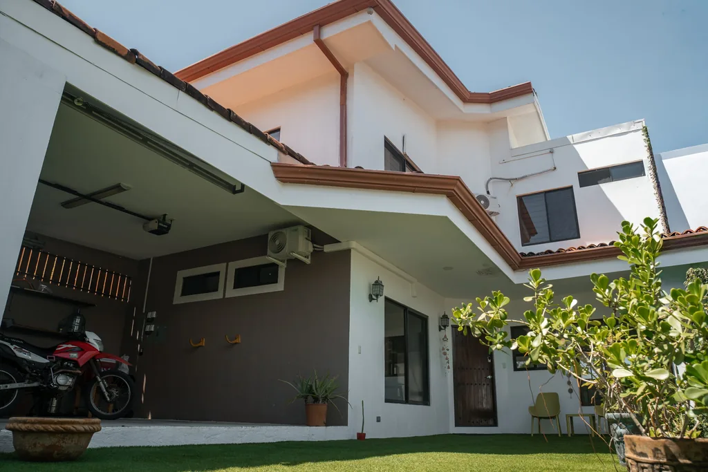 Turnkey two-story home with covered patio, carport and landscaped garden in Guanacaste, Costa Rica