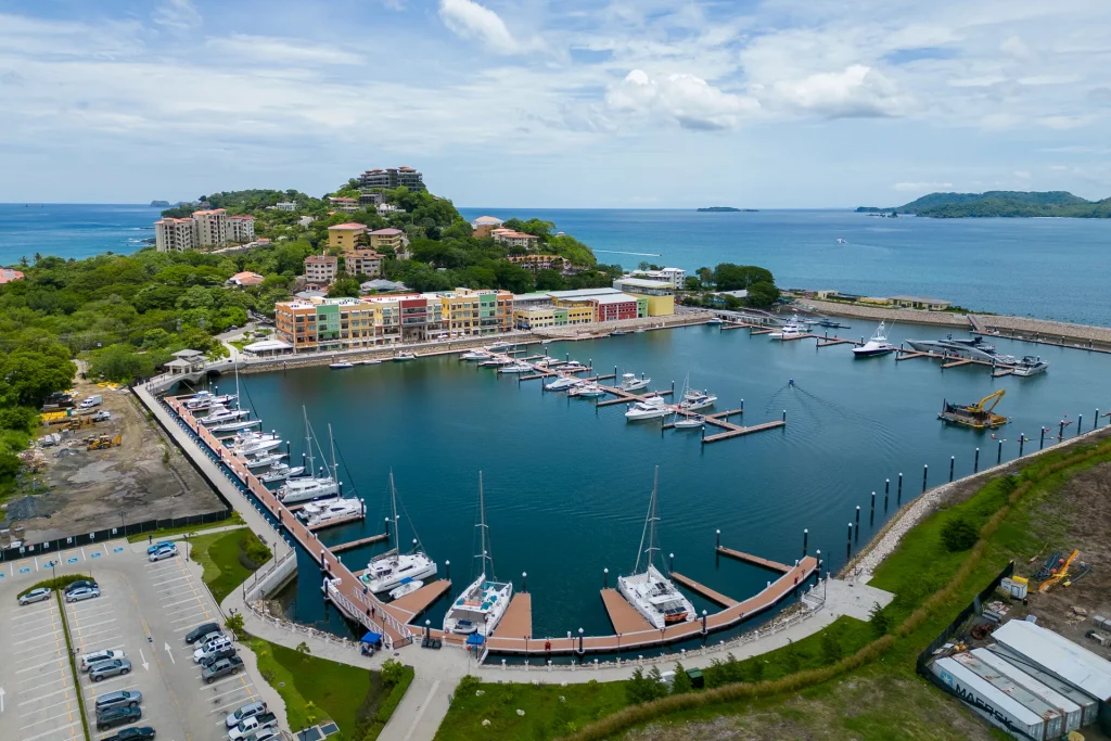 Aerial view of Flamingo Marina near Mar Vista, with yachts and sailboats docked and the Guanacaste coastline beyond, Costa Rica