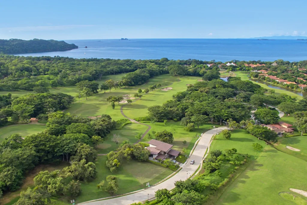 Aerial view of the Reserva Conchal golf course, community roads, and Pacific Ocean beyond, Guanacaste, Costa Rica