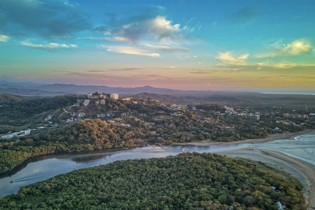 Aerial view of Tamarindo, Costa Rica real estate and coastline from the sea