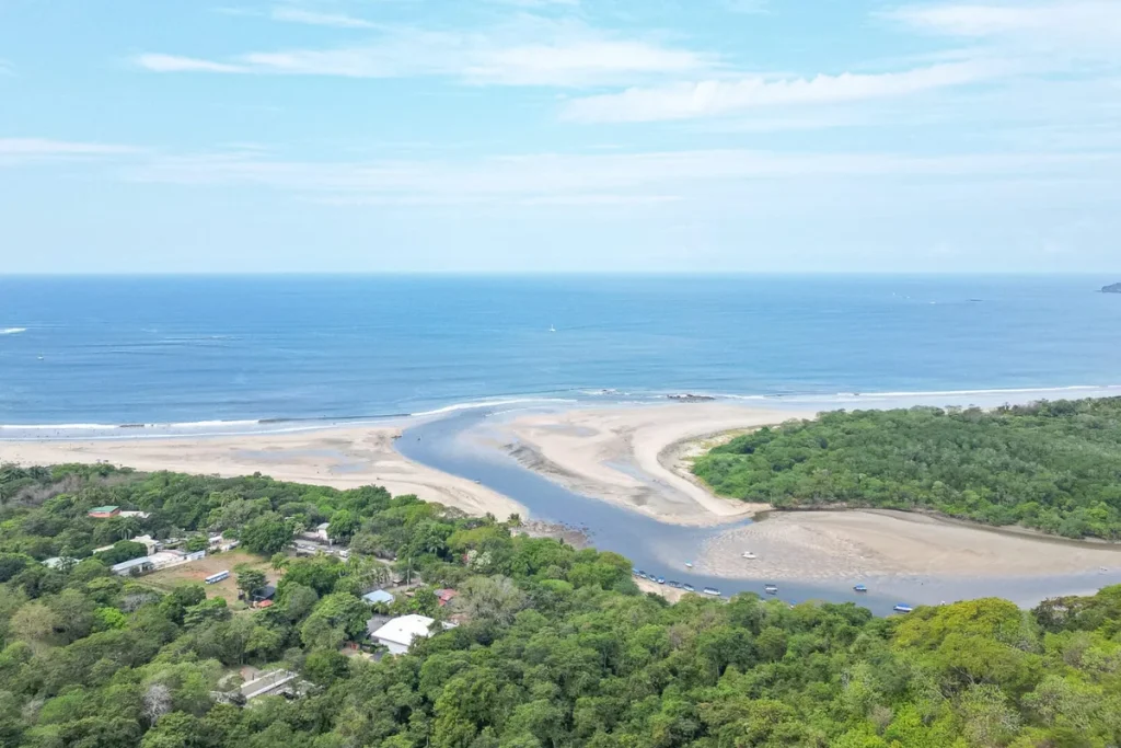 View from the Senderos hillside over Playa Tamarindo and the Tamarindo estuary, Guanacaste, Costa Rica